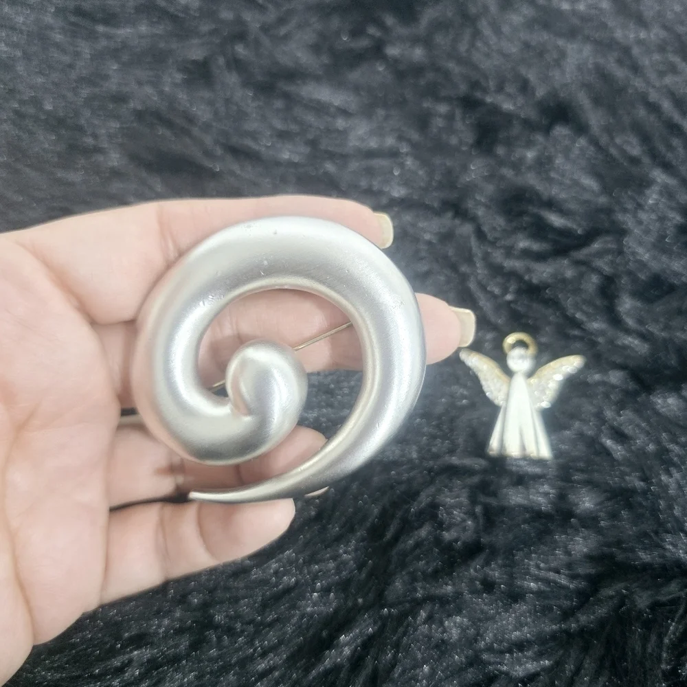 Monet Jewelry two silver-tone brooches